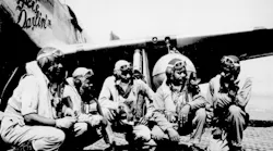 Fliers of a P-51 Mustang Group of the 15th Air Force in Italy `shoot the breeze' in the shadow of one of the Mustangs they fly. Left to right: Lt. Dempsey W. Morgan, Jr.; Lt. Carroll S. Woods; Lt. Robert H. Nelson, Jr.; Capt. Andrew D. Turner; and Lt. Clarence P. Lester.