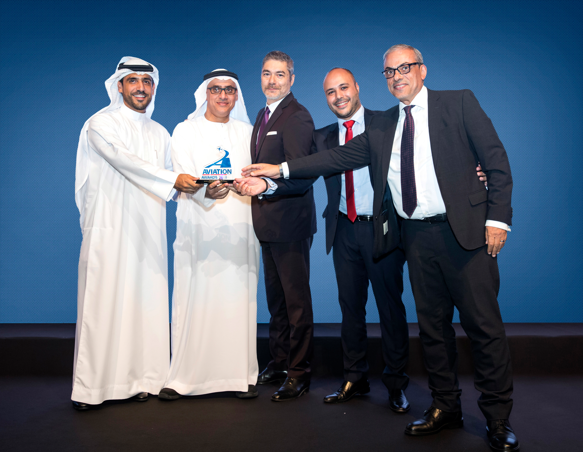 Etihad Airways Engineering celebrates a double-win at the Aviation Business Awards 2018. Left to right: Mansoor Janahi (award sponsor) presents the award to Saleh Al Amoudi, Frederic Dupont, Elie Dib and Haytham Nasir representing Etihad Airways Engineering.