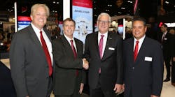 (L-R) Warren Kroeppel, Sheltair, COO; Frank Seymour, Sheltair, SVP; Joe Moeggenberg, ARGUS, CEO; Tom Craft, Sheltair, SVP of FBO Operations. Joe Moeggenberg congratulates Sheltair&rsquo;s executive team at the Sheltair booth on Tuesday, Oct. 16, 2018 during NBAA-BACE 2018.