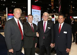 (L-R) Warren Kroeppel, Sheltair, COO; Frank Seymour, Sheltair, SVP; Joe Moeggenberg, ARGUS, CEO; Tom Craft, Sheltair, SVP of FBO Operations. Joe Moeggenberg congratulates Sheltair&rsquo;s executive team at the Sheltair booth on Tuesday, Oct. 16, 2018 during NBAA-BACE 2018.