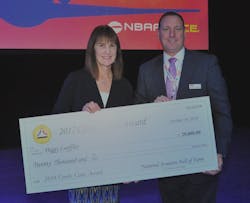 Peggy Loffler and NEAM Board President Scott Ashton receive the Combs Gate Award from the National Aviation Hall of Fame. Peggy Loffler and NEAM Board President Scott Ashton receive the Combs Gate Award from the National Aviation Hall of Fame.