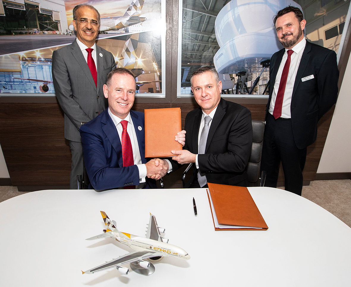 (Left to right) Abdul Khaliq Saeed, Chief Executive Officer, Etihad Airways Engineering and Tony Douglas, Group Chief Executive Officer, Etihad Aviation Group with Mark Brooks, Aircraft Commercial Global Support General Manager, Moog Inc and Peter Evans, Director Sales and Business Development at the Bahrain International Airshow