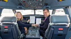 Michele Evans, Lockheed Martin Aeronautics Executive Vice President, and Fernando Alonso, Airbus Defence and Space Head of Military Aircraft, shake hands after signing a Memorandum of Agreement.