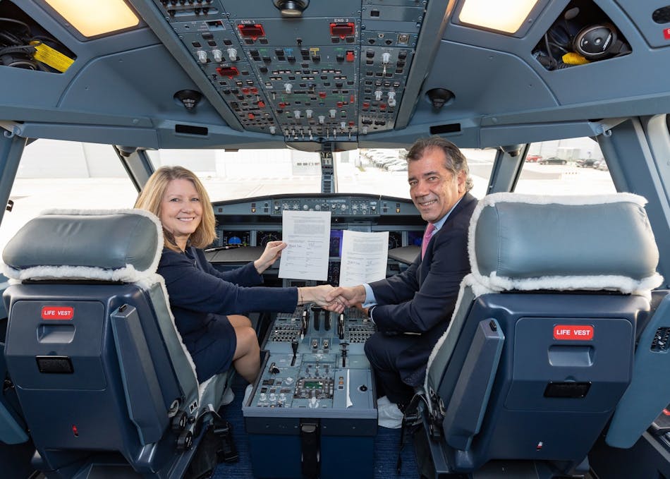 Michele Evans, Lockheed Martin Aeronautics Executive Vice President, and Fernando Alonso, Airbus Defence and Space Head of Military Aircraft, shake hands after signing a Memorandum of Agreement.