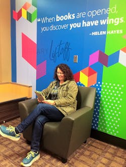 Susan Knight enjoys an eBook at the Library Liftoff corner at Gate D while waiting to board her flight to Tucson at Bellingham International Airport.