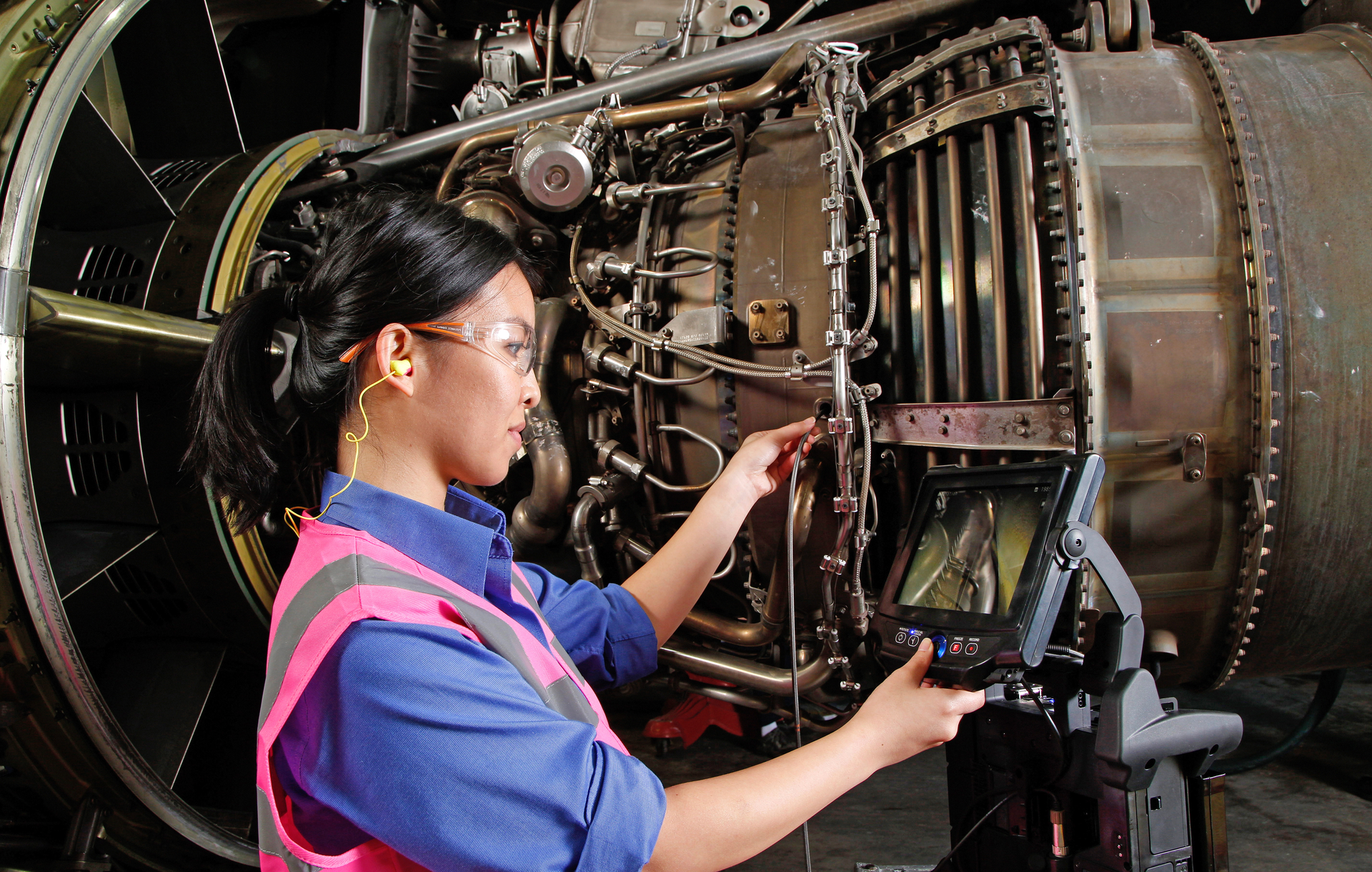Inspecting a jet engine with a videoscope.