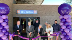 Cutting the ribbon to open the new C Gate facility at Tucson International Airport are, from left, Brent DeRaad, President/CEO of Visit Tucson; Bruce Dusenberry, Secretary of the Tucson Airport Authority Board of Directors; Tucson Mayor Jonathan Rothschild; Bonnie Allin, President and CEO of the TAA. Behind them, from left are Justin Tunstill from S D Crane Builders and Richard Beach and Ryan Schmitt from DL Group architects.
