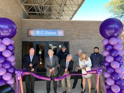 Cutting the ribbon to open the new C Gate facility at Tucson International Airport are, from left, Brent DeRaad, President/CEO of Visit Tucson; Bruce Dusenberry, Secretary of the Tucson Airport Authority Board of Directors; Tucson Mayor Jonathan Rothschild; Bonnie Allin, President and CEO of the TAA. Behind them, from left are Justin Tunstill from S D Crane Builders and Richard Beach and Ryan Schmitt from DL Group architects. Cutting the ribbon to open the new C Gate facility at Tucson International Airport are, from left, Brent DeRaad, President/CEO of Visit Tucson; Bruce Dusenberry, Secretary of the Tucson Airport Authority Board of Directors; Tucson Mayor Jonathan Rothschild; Bonnie Allin, President and CEO of the TAA. Behind them, from left are Justin Tunstill from S D Crane Builders and Richard Beach and Ryan Schmitt from DL Group architects.