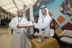 (From left): A young innovator at Think Science Fair, with Abdul Rahman Ahmad Alawi, IT Project Officer, Etihad Airways, at Etihad Aviation Group's stand. (From left): A young innovator at Think Science Fair, with Abdul Rahman Ahmad Alawi, IT Project Officer, Etihad Airways, at Etihad Aviation Group's stand.