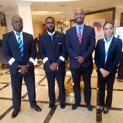 Dawit Lemma, Krimson MD (second from right), welcomes the crew of Bestfly, Krimson&apos;s 150th flight.