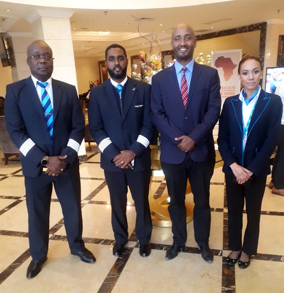 Dawit Lemma, Krimson MD (second from right), welcomes the crew of Bestfly, Krimson&apos;s 150th flight.