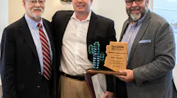 Pictured from left to right: (in the back: TAA Board Chair Lisa Lovallo), TAA Board Secretary Bruce L. Dusenberry, Visit Tucson President/CEO Brent DeRaad and Visit Tucson Executive Vice President Felipe Garcia