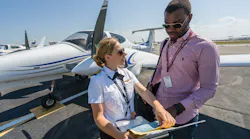 Abigail Pasmore, flight instructor, worked with flight student Eric Tetteh on the Embry-Riddle flight line in 2016. Tetteh is now an instructor pilot.