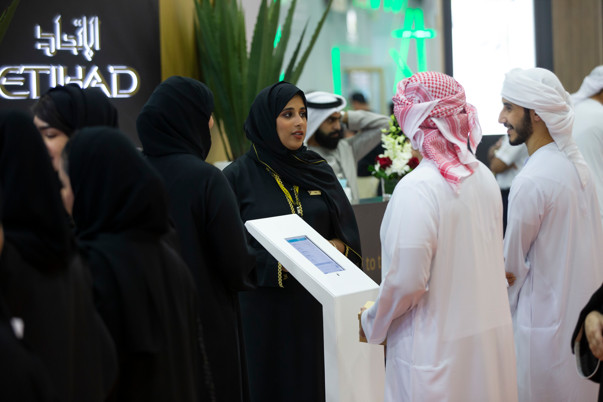 Alia Alshaqqa, Etihad Airways Guest Service Agent, introducing the career programs to visitors at Etihad stand during the UAE Careers-Dubai.