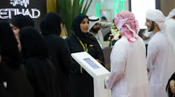 Alia Alshaqqa, Etihad Airways Guest Service Agent, introducing the career programs to visitors at Etihad stand during the UAE Careers-Dubai.