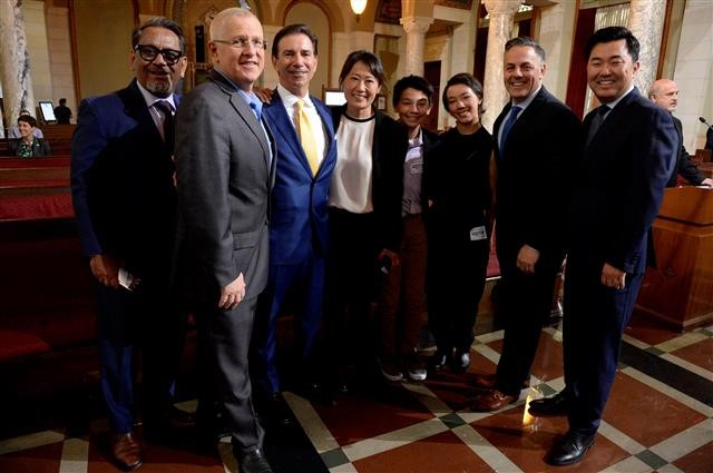 Commissioner Nicholas P. Roxborough (third from the left) is joined by his family and City Council members Cedillo, Bonin, Buscaino and Ryu (left to right) after today's vote to approve his appointment to the Board of Airport Commissioners.