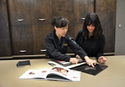 Summer Sun, manager of interior design, chats with a potential new recruit in the Flying Colours design suite. Summer Sun, manager of interior design, chats with a potential new recruit in the Flying Colours design suite.