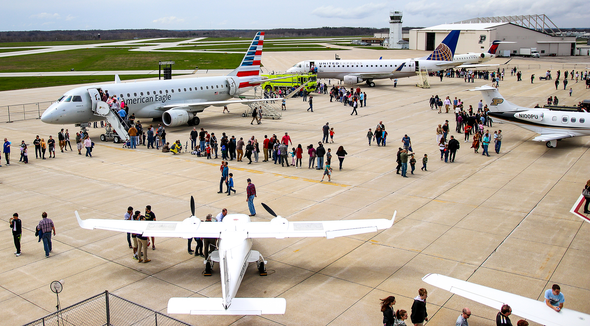 Crowds line up to check out the variety of planes flown in for the 2018 Aviation Day.