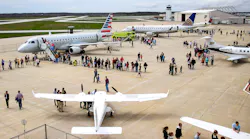 Crowds line up to check out the variety of planes flown in for the 2018 Aviation Day.