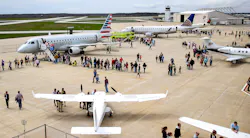 Crowds line up to check out the variety of planes flown in for the 2018 Aviation Day.