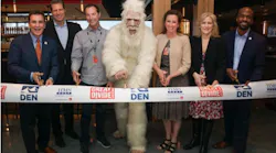 A ribbon cutting celebrates the grand opening of Great Divide Brewhouse and Kitchen at Denver International Airport. Pictured from left to right: HMSHost Vice President of Business Development Stephen Douglas; HMSHost President and CEO Steve Johnson; Great Divide Brewing Co. Founder Brian Dunn; Great Divide’s Yeti; Colleen Forst; Denver International Airport CEO Kim Day; and Denver City Councilman Christopher Herndon.