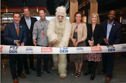 A ribbon cutting celebrates the grand opening of Great Divide Brewhouse and Kitchen at Denver International Airport. Pictured from left to right: HMSHost Vice President of Business Development Stephen Douglas; HMSHost President and CEO Steve Johnson; Great Divide Brewing Co. Founder Brian Dunn; Great Divide’s Yeti; Colleen Forst; Denver International Airport CEO Kim Day; and Denver City Councilman Christopher Herndon. A ribbon cutting celebrates the grand opening of Great Divide Brewhouse and Kitchen at Denver International Airport. Pictured from left to right: HMSHost Vice President of Business Development Stephen Douglas; HMSHost President and CEO Steve Johnson; Great Divide Brewing Co. Founder Brian Dunn; Great Divide’s Yeti; Colleen Forst; Denver International Airport CEO Kim Day; and Denver City Councilman Christopher Herndon.