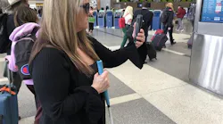 An Aira guide connects to Maria Johnson's smartphone and provides real-time descriptions of the Tom Bradley International Terminal's Departures level.
