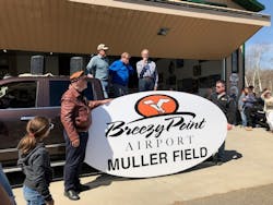 Jeff Smith, Cliff Muller, Mayor Tom Lillehei and Cliff Muller in front of new sign.