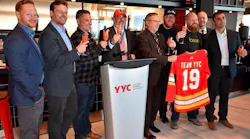 Representatives celebrate YYC’s Domestic Terminal dining refresh and the grand opening of The Burger Federation.