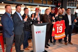 Representatives celebrate YYC’s Domestic Terminal dining refresh and the grand opening of The Burger Federation. Representatives celebrate YYC’s Domestic Terminal dining refresh and the grand opening of The Burger Federation.