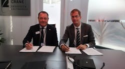 Gregg Herman, VP Sales and Marketing (left) and Bart Reijnen, Chief Executive Officer, Satair sign the contract at Paris Air Show.