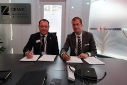 Gregg Herman, VP Sales and Marketing (left) and Bart Reijnen, Chief Executive Officer, Satair sign the contract at Paris Air Show.
