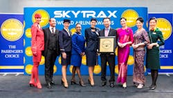 Star Alliance CEO Jeffrey Goh flanked by member airlines cabin crew