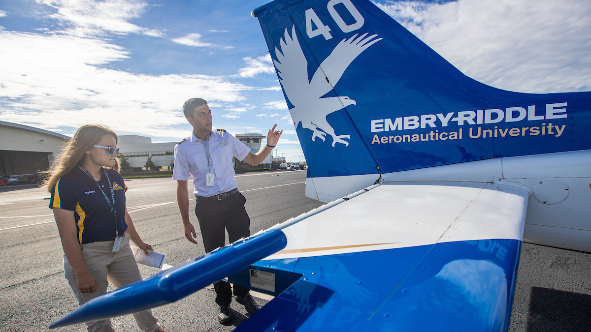 Sydney Pilling And Tyler Rispoli Inspect Cessna