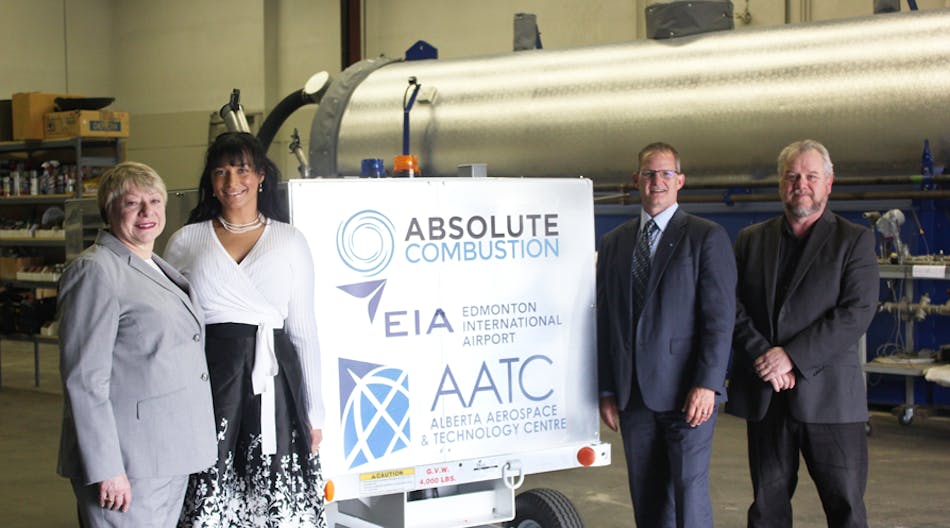 From left to right: Laura Kilcrease, CEO of Alberta Innovates, Koleya Karringten, CEO of Absolute Combustion International, Steve Maybee, VP of Operations and Infrastructure, Edmonton International Airport and Rollie Dykstra, VP of Investments, Alberta Innovates, pose in front of the new Absolute Combustion International-SM1000 portable aircraft heater, tested and produced in Alberta.