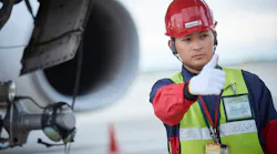 A Worker Of Swissport In The Japanese Tokyo Airport