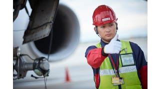 A Worker Of Swissport In The Japanese Tokyo Airport