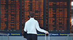 Man Viewing Fids Screen In Airport 1250x833