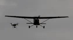A drone is shown encroaching on a small aircraft in flight. Photo courtesy of A drone is shown encroaching on a small aircraft in flight.