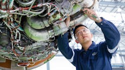 A technician working on an engine at Executive Haite Aviation Services China.
