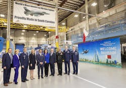Shaikh Abdullah bin Rashed Al Khalifa, ambassador of the Kingdom of Bahrain to the United States (center) tours the Lockheed Martin F-16 production line in Greenville, South Carolina, on Dec. 17.