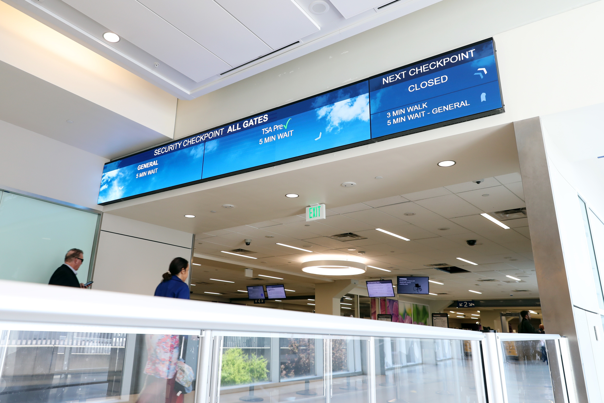 Replacing static signage with digital displays allows DFW to provide dynamic messaging to travelers entering the TSA security checkpoint.