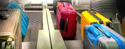 Colorful Suitcases Check In Counter 767x300