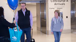 Delta Air Lines passenger Keith O’Brien (left), and Southwest passenger Karen Burleson, were surprised as the “GRRand Passengers” as the Ford Airport celebrated its record-setting 2019