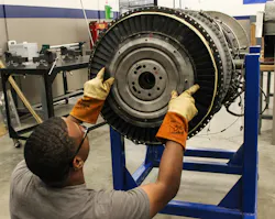 MIAT College of Technology student rebuilding a jet engine. MIAT College of Technology student rebuilding a jet engine.
