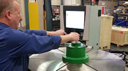 RPI engineer demonstrating Curvic tooling which significantly reduces set up times and helps to improve the overall performance of the meas