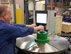 RPI engineer demonstrating Curvic tooling which significantly reduces set up times and helps to improve the overall performance of the meas