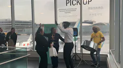 Kareem Thompson performs for T4 customers traveling with Caribbean Airlines as they board their flight.