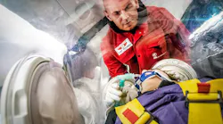 FAI transports COVID-19 patients using EpiShuttle portable medical isolation unit.