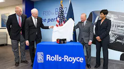 Unveiling an electronic engine controller for the Rolls-Royce AE 3007H jet engine during an announcement of a new engine controls facility in Discovery Park District are from left Brian Edelman, president of Purdue Research Foundation; Tom Bell, president of defense and CEO of Rolls-Royce North America; Mitch Daniels, Purdue University president; and Candice Bineyard, director of defense programs for Rolls-Royce North America.